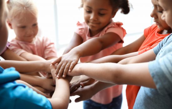 Little,Children,Putting,Their,Hands,Together,,Closeup.,Unity,Concept